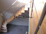 Escalier en limon central en inox marches en bois